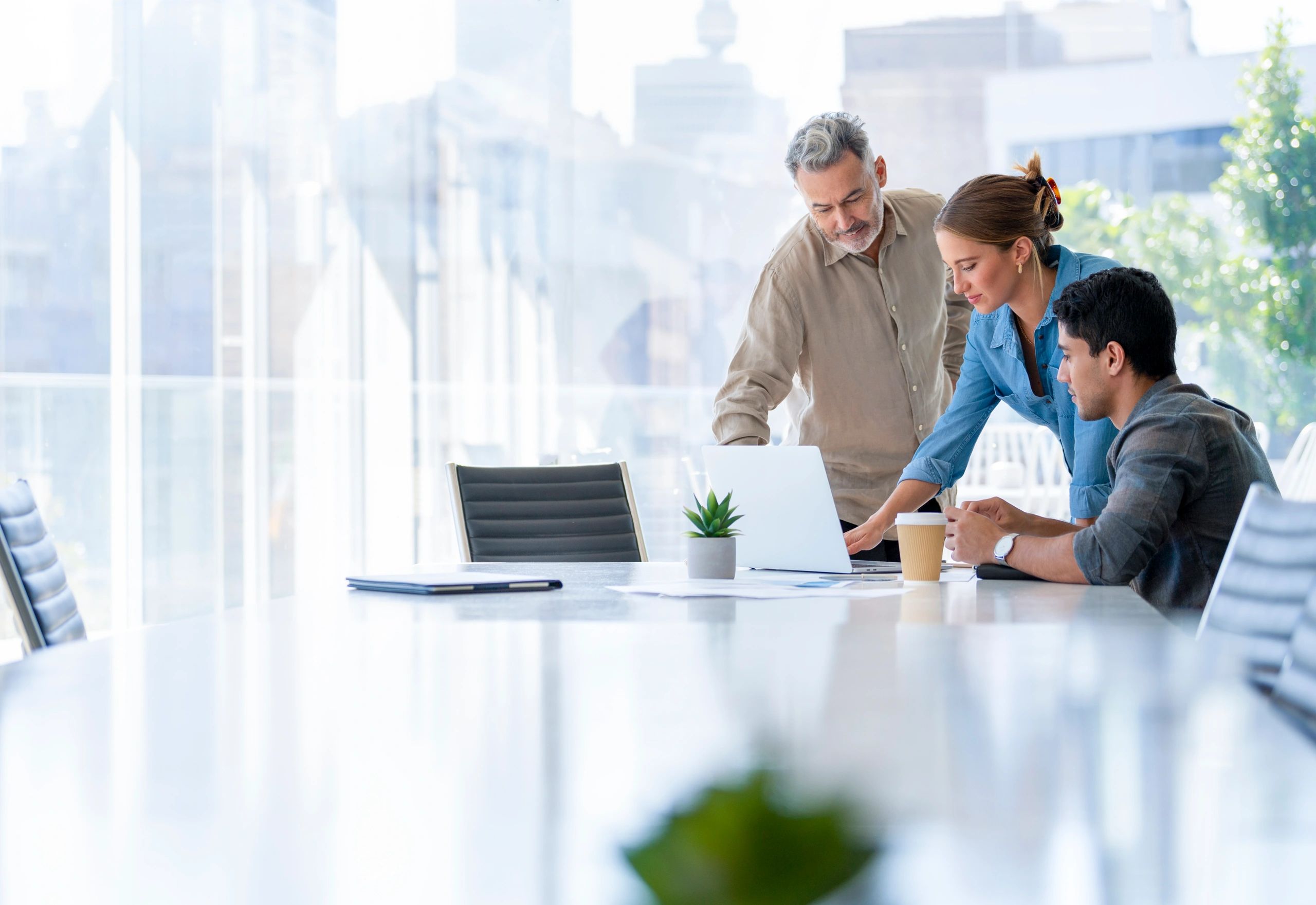 Business team reviewing plans together in a boardroom