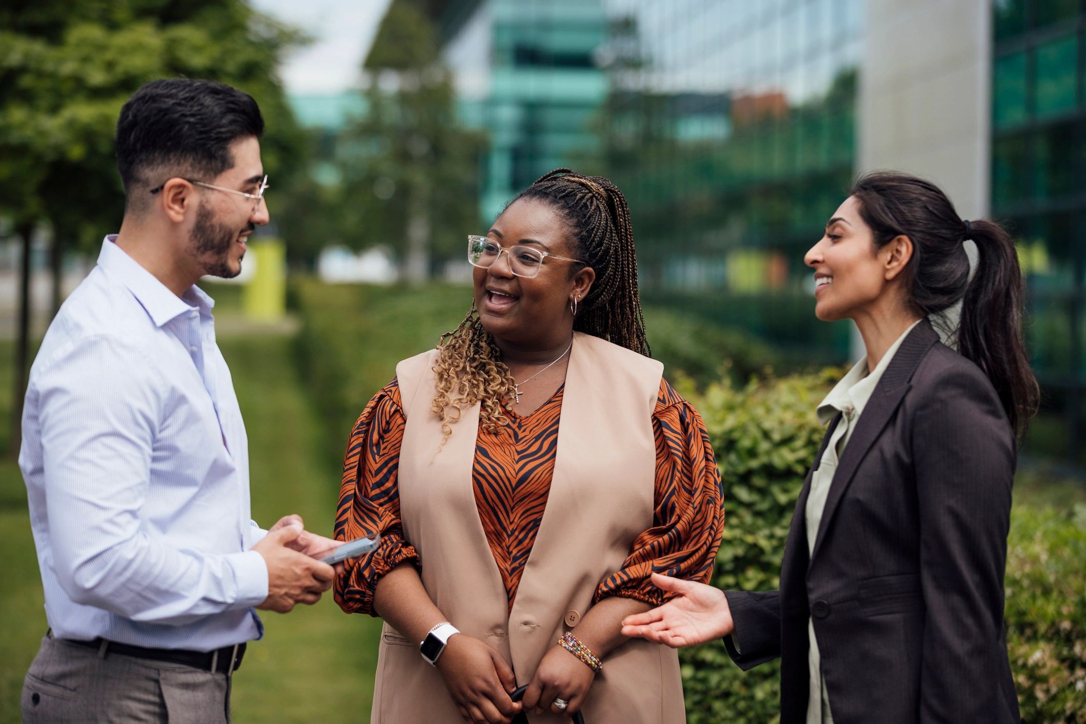 Colleagues in discussion outside the office