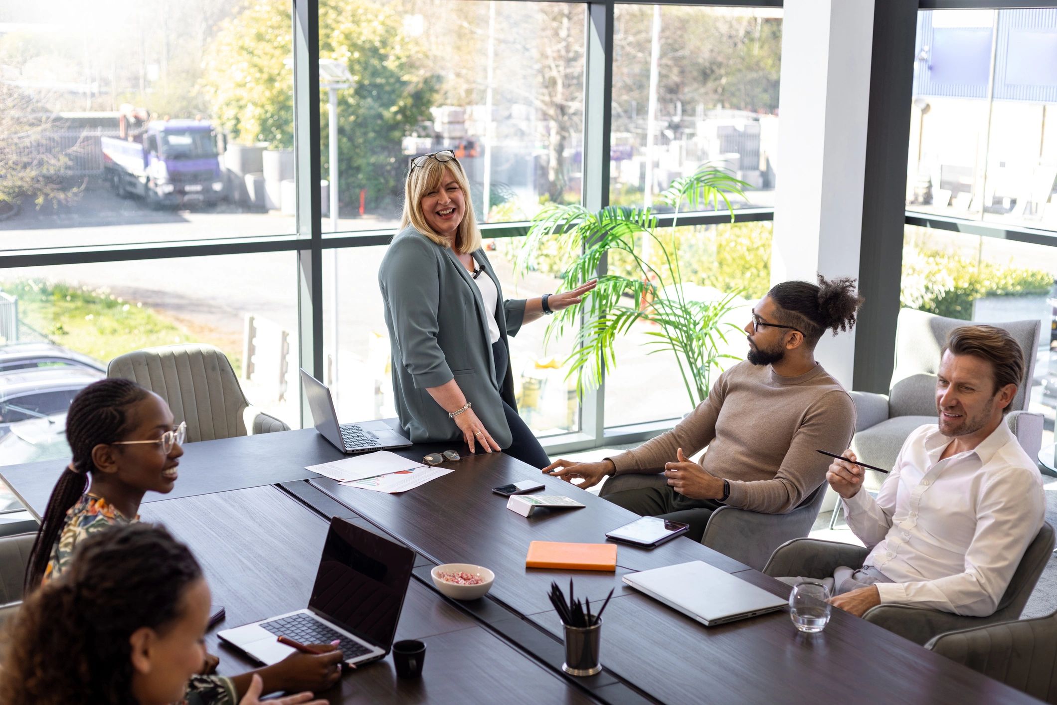 Business leader presenting to a startup team in a conference room